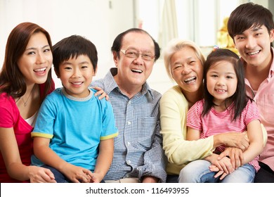 Portrait Of Multi-Generation Chinese Family Relaxing At Home Together