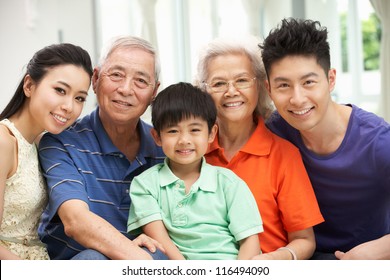 Portrait Of Multi-Generation Chinese Family Relaxing At Home Together