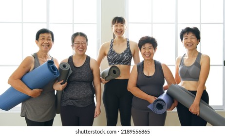 Portrait of Multi-generation woman, diverse age in family workout exercise and practice yoga together at gym - Powered by Shutterstock