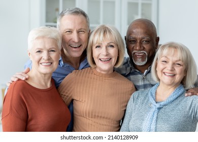 Portrait Of Multiracial Group Of Happy Senior Friends Men And Women In Casual Outfits Enjoying Time Together, Cheerfully Smiling At Camera, Kitchen Interior. Elderly People Lifestyle