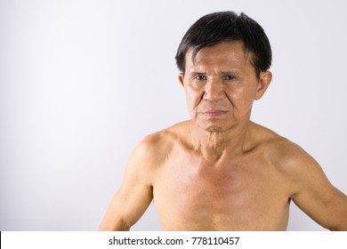 Portrait Of Muscular Naked Fit Strong Asian Chinese Middle Age Very Old Man Looking At The Camera. Show His Muscle. Yellow Brown Tan Skin. Healthy Concept. White Background.