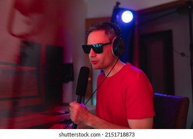 Portrait Of A Music Producer Singing In Order To Place Some Vocal Layers For A Project During A Recording Session At His Home Studio