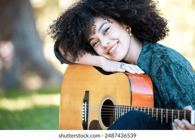 Portrait, musician and woman with guitar in outdoor park for music performance, busking or learning song. Artist, smile and female person with string instrument for hobby, acoustic or relax in nature - Powered by Shutterstock