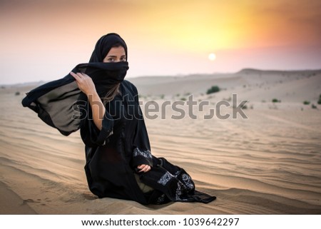 Similar – Image, Stock Photo Lonely veiled  girl in the barren Arabian desert at Sunset