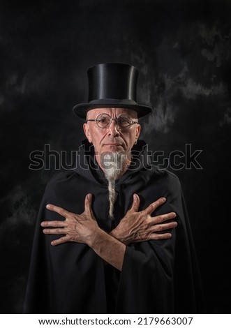 Similar – Man in tails with bouquet and top hat looks into camera