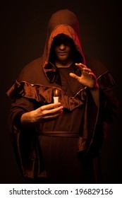 Portrait of mystery unrecognizable monk in robe