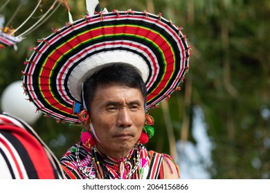 Portrait of a Naga tribes man dressed in traditional attire and headgear at Kohima Nagaland India on 4 December 2016
