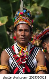 Portrait of a Naga tribesman dressed in traditional tribal attire during Hornbill Festival at Kohima Nagaland India on 4 December 2016

