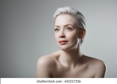 Portrait Of Natural Beauty Woman With Short Platinum Blonde Hair.