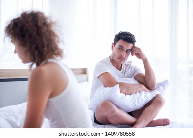 Portrait Of Newlywed Have A Fight In Bed. The Couple Having Difficulties In Relationship. Wife Always Sulking & Husband Get Angry Easily. He Has Problem With Erection Too. Domestic Violence Concept. 