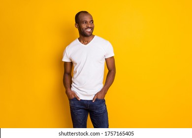 Portrait Of Nice Attractive Candid Afro American Guy Look Copyspace Enjoy Spring Free Time Weekend Put Hands Pocket Wear Modern Outfit Isolated Over Bright Color Background