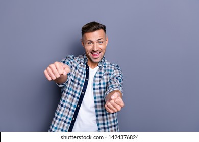 Portrait of nice attractive confident cheerful cheery glad bearded guy wearing checked shirt holding in hands driving invisible car isolated over blue pastel background