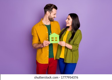 Portrait Of Nice Attractive Glad Cheerful Cheery Friends Friendship Holding In Hands Green House Form Sale Bank Loan Purchase Isolated Bright Vivid Shine Vibrant Lilac Violet Purple Color Background