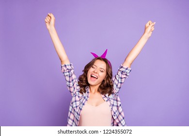 Portrait of nice cheerful cheery glad lovely attractive adorable lady closed eyes opened mouth raising hands up rejoicing having fun isolated over violet pastel background - Shutterstock ID 1224355072