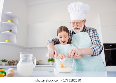 Portrait Of Nice Cheerful Kind Grey-haired Grandpa Grandchild Cooking Homemade Domestic Dough Dish Meal Easter Pizza Pie Braking Eggs At Modern Light White Interior Kitchen House