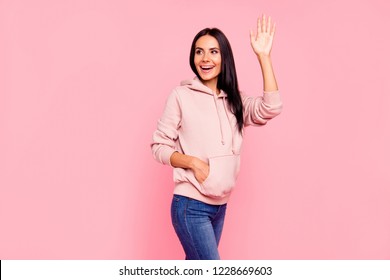Portrait of nice cute sweet lovely attractive adorable charming pretty cheerful friendly latin girl in sweater jeans waving good-bye isolated over pastel pink background