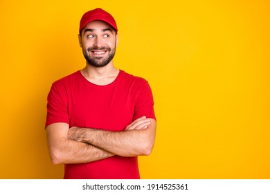 Portrait of nice funky content cheerful guy mailman folded arms looking aside copy space isolated over vibrant yellow color background