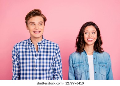 Portrait of nice sweet charming lovely attractive cheerful cheery positive confused flirty couple isolated over pink pastel background