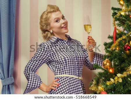 portrait of nice young woman hanging around christmas tree on x-mas  eve  