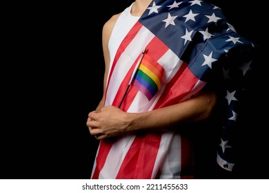 A Portrait Of A Nineteen Year Old Teen Boy On A Black Background With An American Flag And White Board And Pride Flags