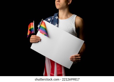 A Portrait Of A Nineteen Year Old Teen Boy On A Black Background With An American Flag And White Board And Pride Flags