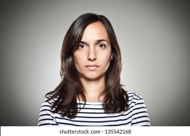 Portrait Of A Normal Girl Looking Camera. / Beautiful Woman Portrait Over Grey Background.