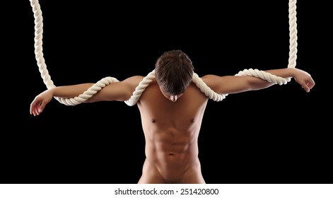 Portrait of nude hanging man bowed his head