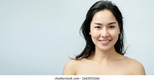 Portrait Nude Young Asian Woman Close Up Of Beautiful Faces Feel Happy. Smile With A Healthy White Teeth. Good Body Skin. Isolated On White Background For Beauty And Skin Care Concepts