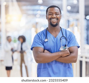 Portrait, nurse and black man with arms crossed, healthcare and happy in hospital. African doctor, face and confident surgeon, medical professional or worker with pride for career, job and wellness. - Powered by Shutterstock