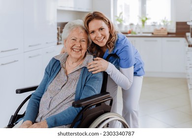 Portrait of nurse and her senior client on wheelchair. - Powered by Shutterstock