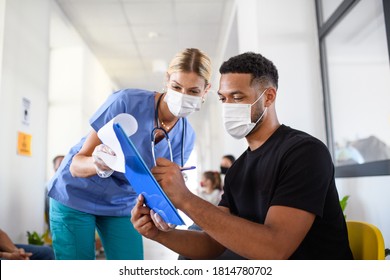 Portrait of nurse and man with face masks, coronavirus, covid-19 and vaccination concept. - Shutterstock ID 1814780702