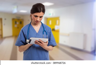 Portrait Of A Nurse Using A Digital Tablet