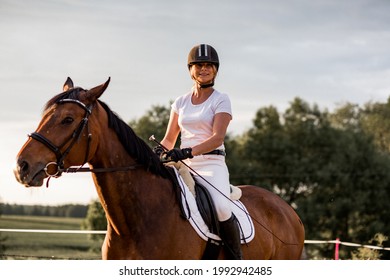 Portrait O Fyoung Laughing Woman On Horse. Concept Of Happiness And Enjoyment Of Wildlife. Sports And Health.Role Model. Active Recreation. The Right Way Of Life. 