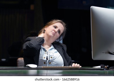 Portrait of office manager woman suffering from neck pain. Female feeling tired, exhausted, stressed. Body and health care concept.