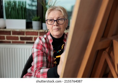 Portrait Of Old Artist Woman Drawing Sketch On Graphic Canvas During Art Courses In Brick Wall Workplace. Group Of People Learning How To Draw Using Illustration Technique. New Years Resolutions