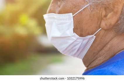 Portrait Of Old Asian Woman Wearing A Mask In The City Street Concept Of Pollution Protective
