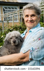 Portrait Of Old Lady With Old Funny Dog