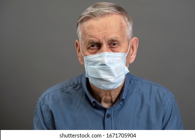 Portrait of an old man, 80 years old, in a medical mask. A concept of the danger of coronavirus for the elderly.