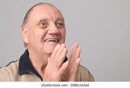 Portrait Old Man Clapping With Amazed Face On Gray Background