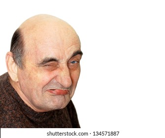 Portrait Of Old Man With A Grimace On His Face