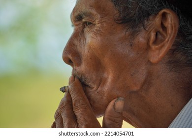 Portrait Of An Old Man Smoking Kretek. Indigenous People. Sundanese Man. PURWAKARTA, INDONESIA - Sept 15, 2021.