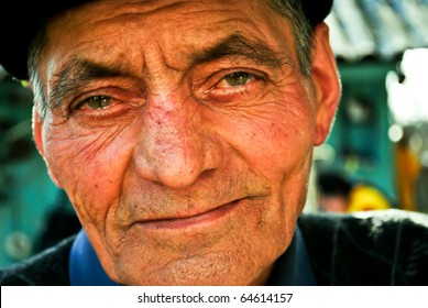 Portrait of an old man with teary eyes