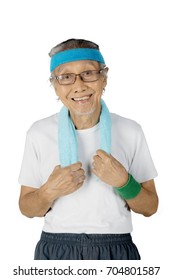 Portrait Of An Old Man Wearing Sportswear While Smiling At The Camera, Isolated On White Background