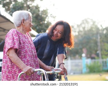 Portrait Of Old Mother With Cheerful Woman Taking Care Of Her Mom. Happy Asian Senior Family Concept.