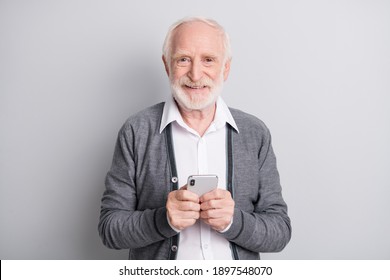 Portrait of old white hair optimistic man write telephone wear dark sweater isolated on grey background