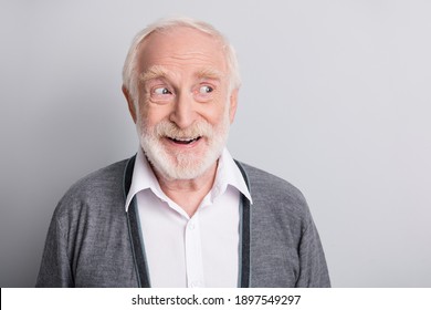 Portrait Of Old White Hair Optimistic Man Look Empty Space Wear Dark Sweater Isolated On Grey Background