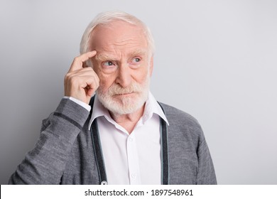 Portrait Of Old White Hair Think Man Look Empty Space Finger Forehead Wear Dark Sweater Isolated On Grey Background