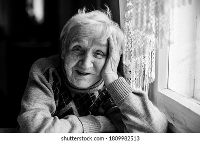 Portrait Of An Old Woman. Black And White Photo.