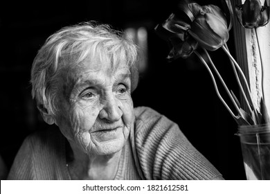 Portrait of an old woman. Black and white photography.
