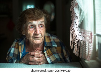 Portrait Of An Old Woman, In Her Home By The Window.